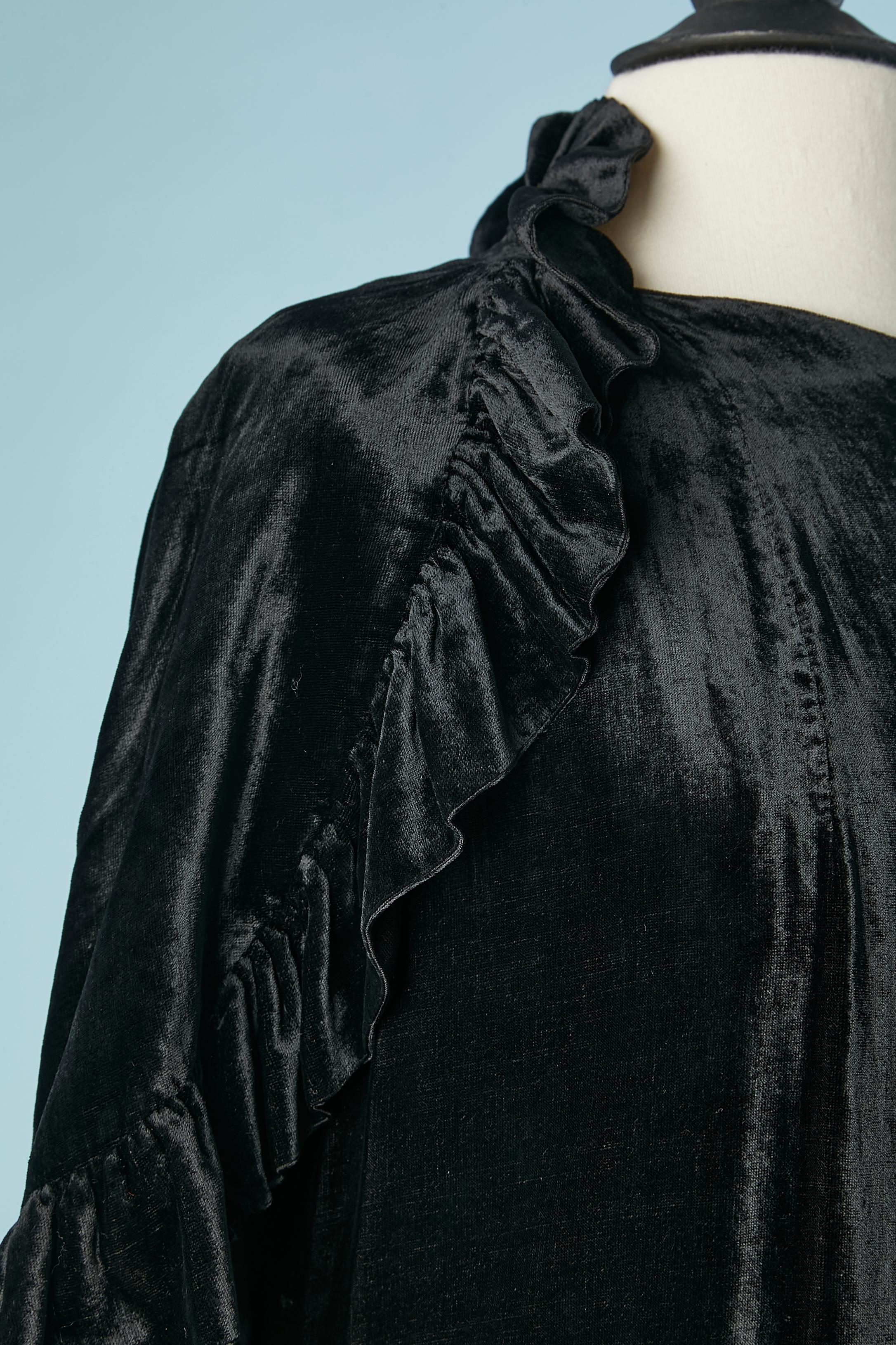 Black silk velvet sleeveless Opera coat with cape.
The coat is close with one snap on the top front and the cape is stitched to the coat. 
Black rayon lining. Ruffles edge on the coat and cape.
SIZE M