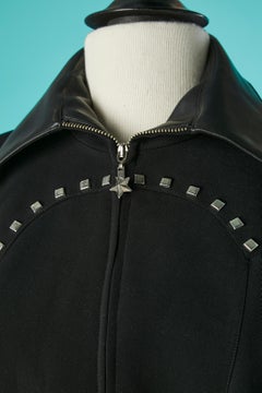 Black skirt suit with silver studs and black leather collar Mugler