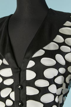 Black skirt-suit with white silk appliqué on the jacket André Laug Circa 1980's