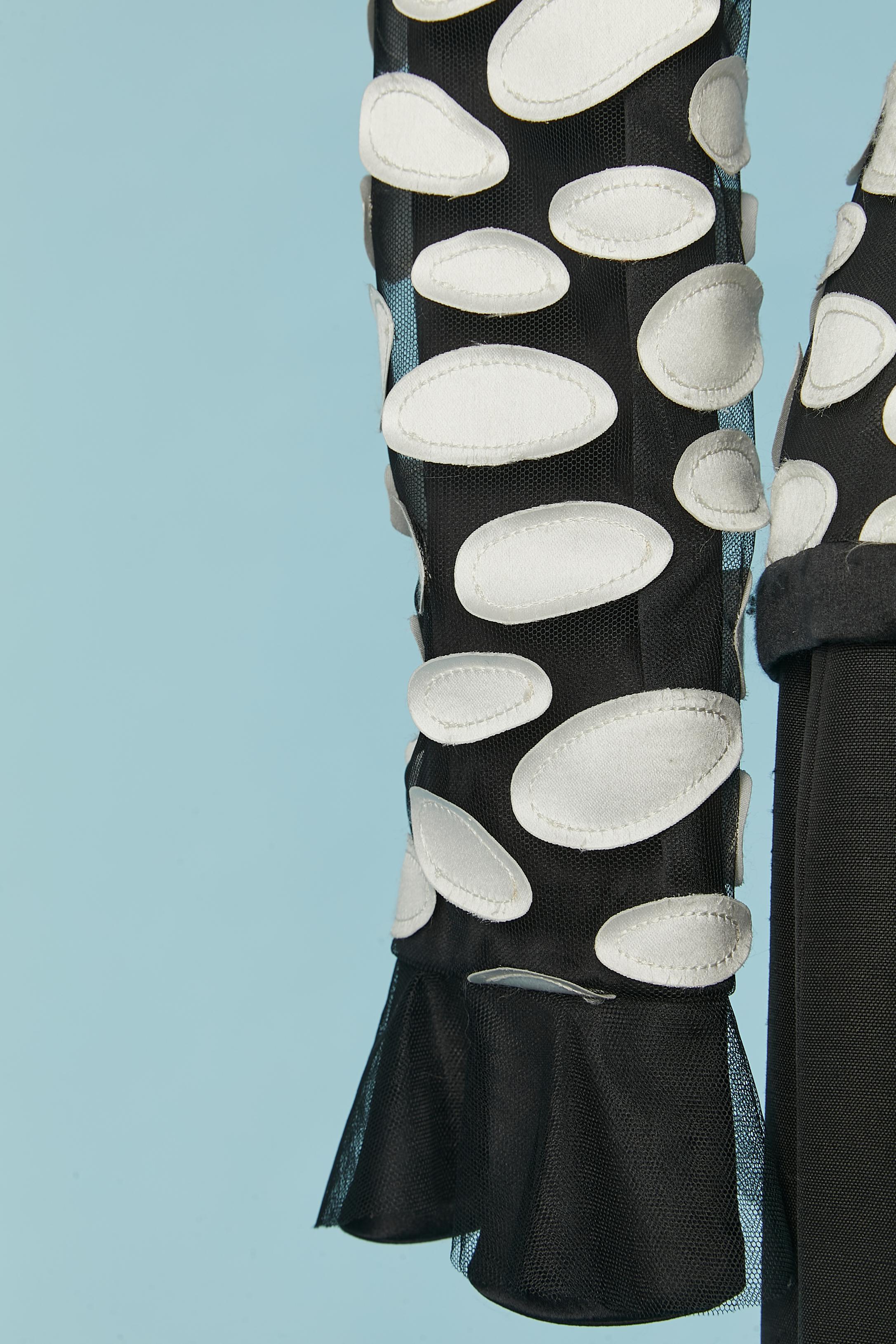 Women's Black skirt-suit with white silk appliqué on the jacket André Laug Circa 1980's For Sale
