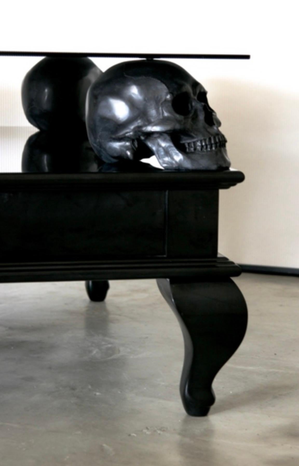The black Skull table is a limited edition of 8, designed and produced in Italy by the artist John Bizas. 
Its design following some of the rococo style principles and 180 degrees against some others has its own particular character between classic
