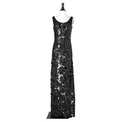 Black sleeveless evening dress covered with small and large sequins