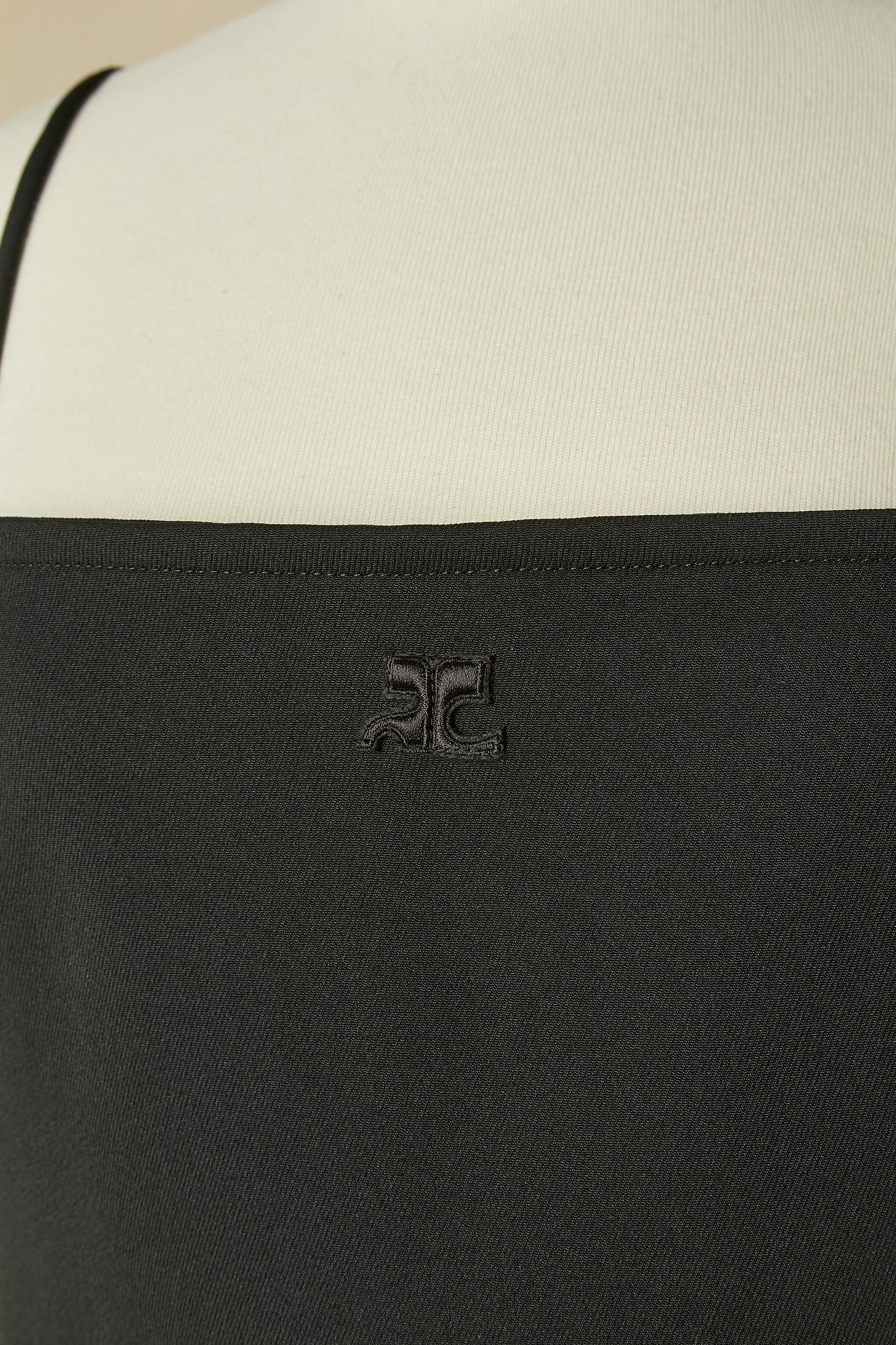 Black slip dress with cut-work on the side of the hips; Main Fabric composition: 83% polyester, 17% acetate. Cupro lining. 
Invisible zip and hook&eye closure on the middle back. High split on both side.
SIZE 38 (Fr) M 