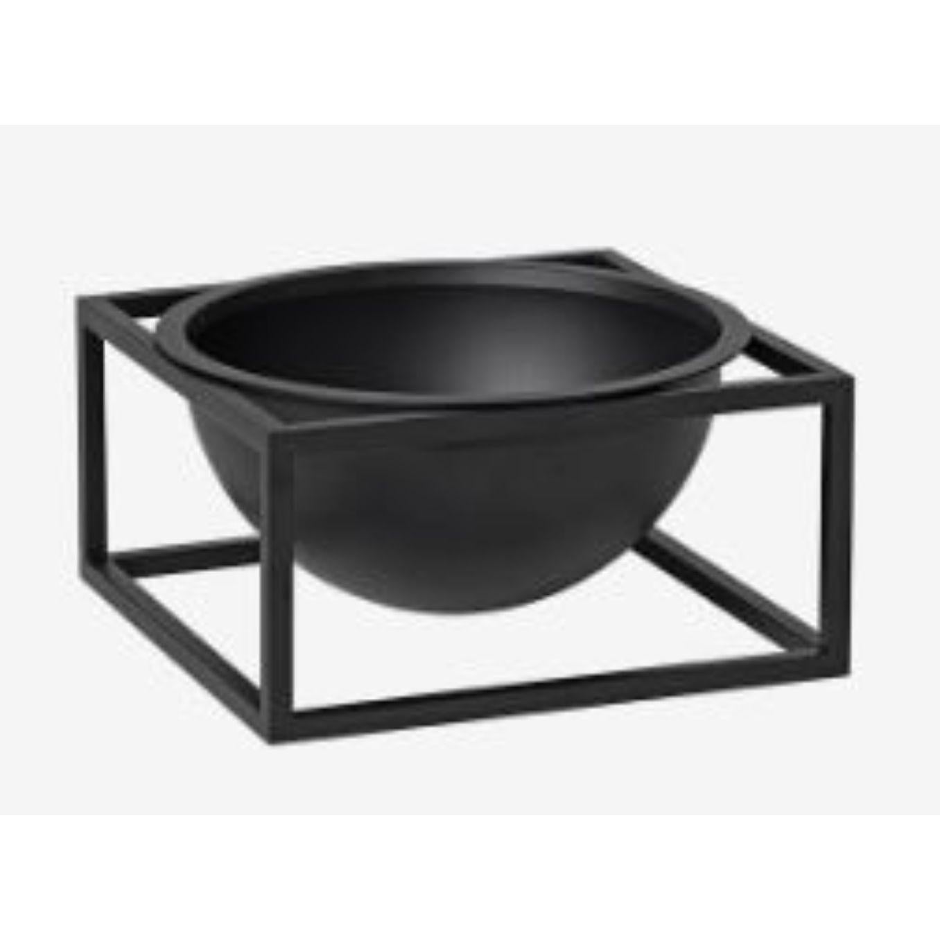 Black small centerpiece Kubus bowl by Lassen
Dimensions: d 14 x w 14 x h 7 cm 
Materials: Metal 
Weight: 1.35 Kg

The dictionary definition is “an object occupying a central, especially an adornment in the center of a table” and the Kubus