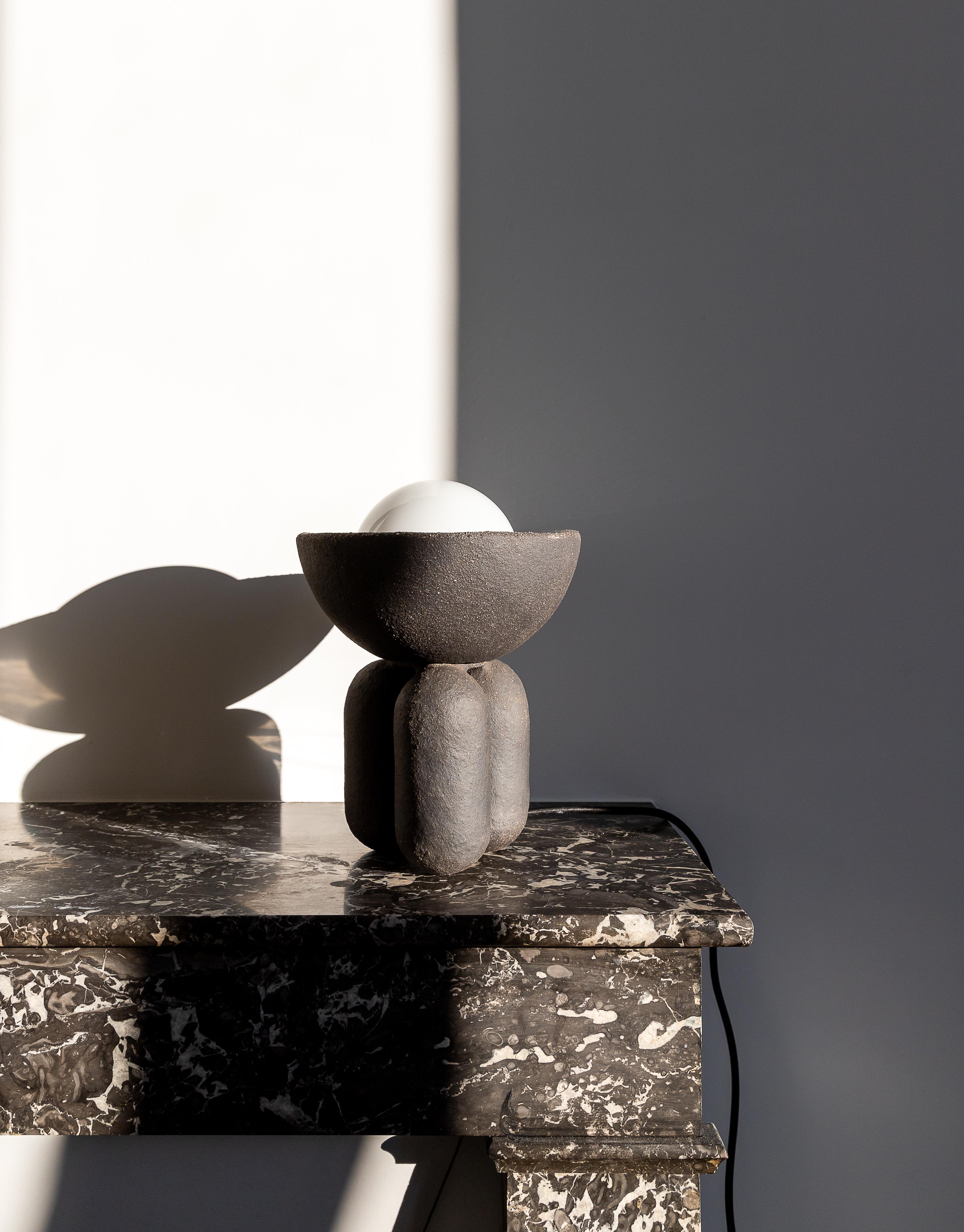 Black small half sphere lamp by Lisa Allegra
Dimensions: Ø 20 x 27 cm
Materials: Clay
Also available in dusty pink finish. Please contact us.
Born in 1986 in Paris, Lisa Allegra has earned in 2010 a degree in furniture design from the École