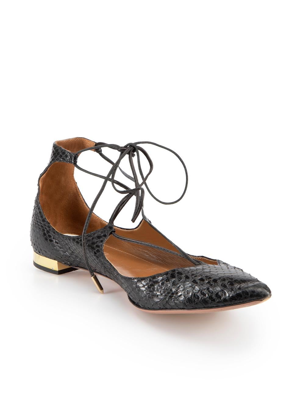 CONDITION is Good. Minor wear to ballet flats is evident. Light wear to inner sole, scuff marks on the heels and one lace cap is missing on this used Aquazzura designer resale item. 



Details


Black

Snakeskin leather 

Strappy ballet