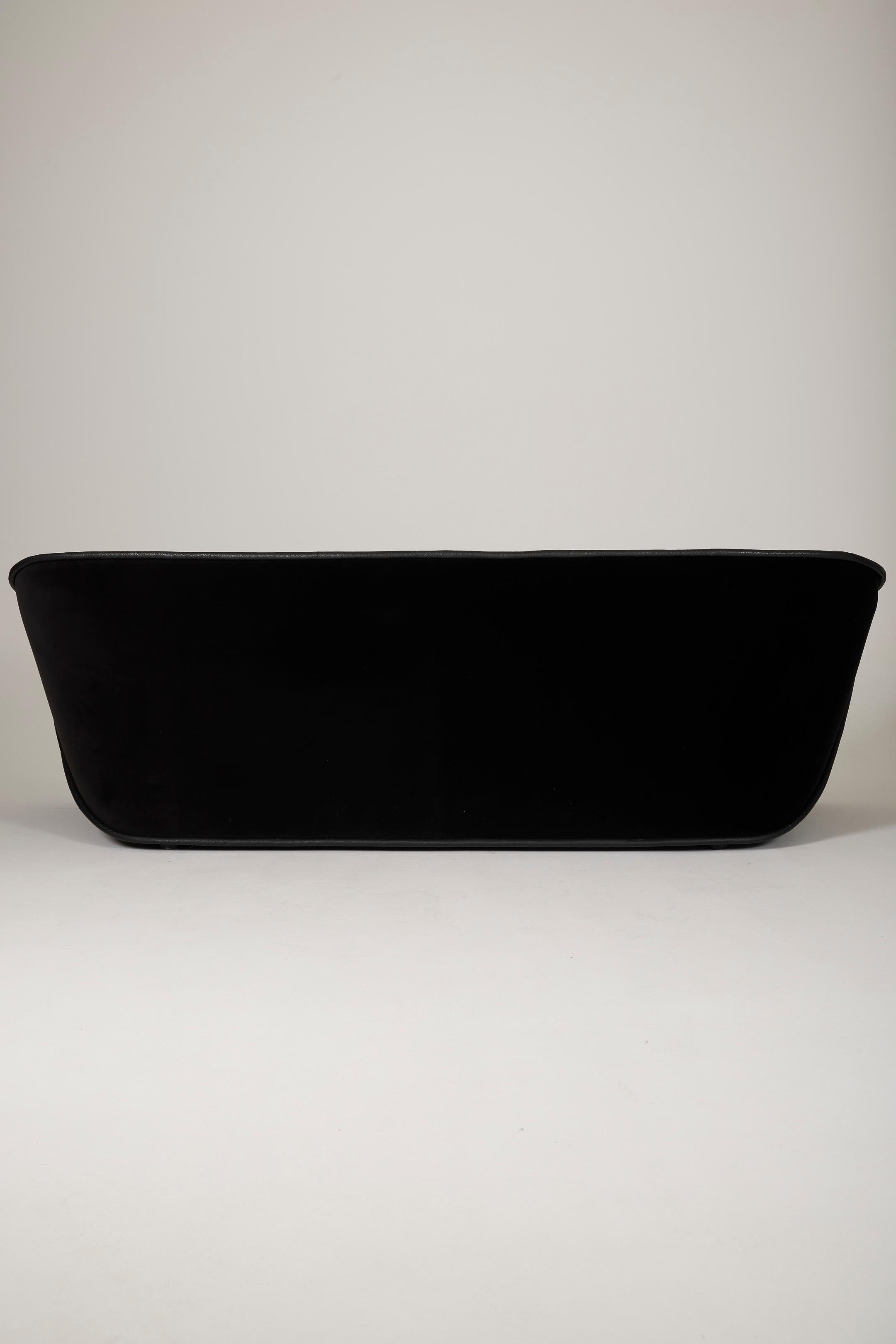Black sofa by Cédric Ragot 1