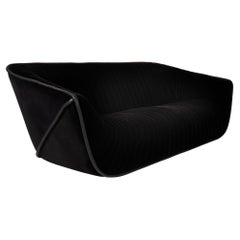 Black sofa by Cédric Ragot