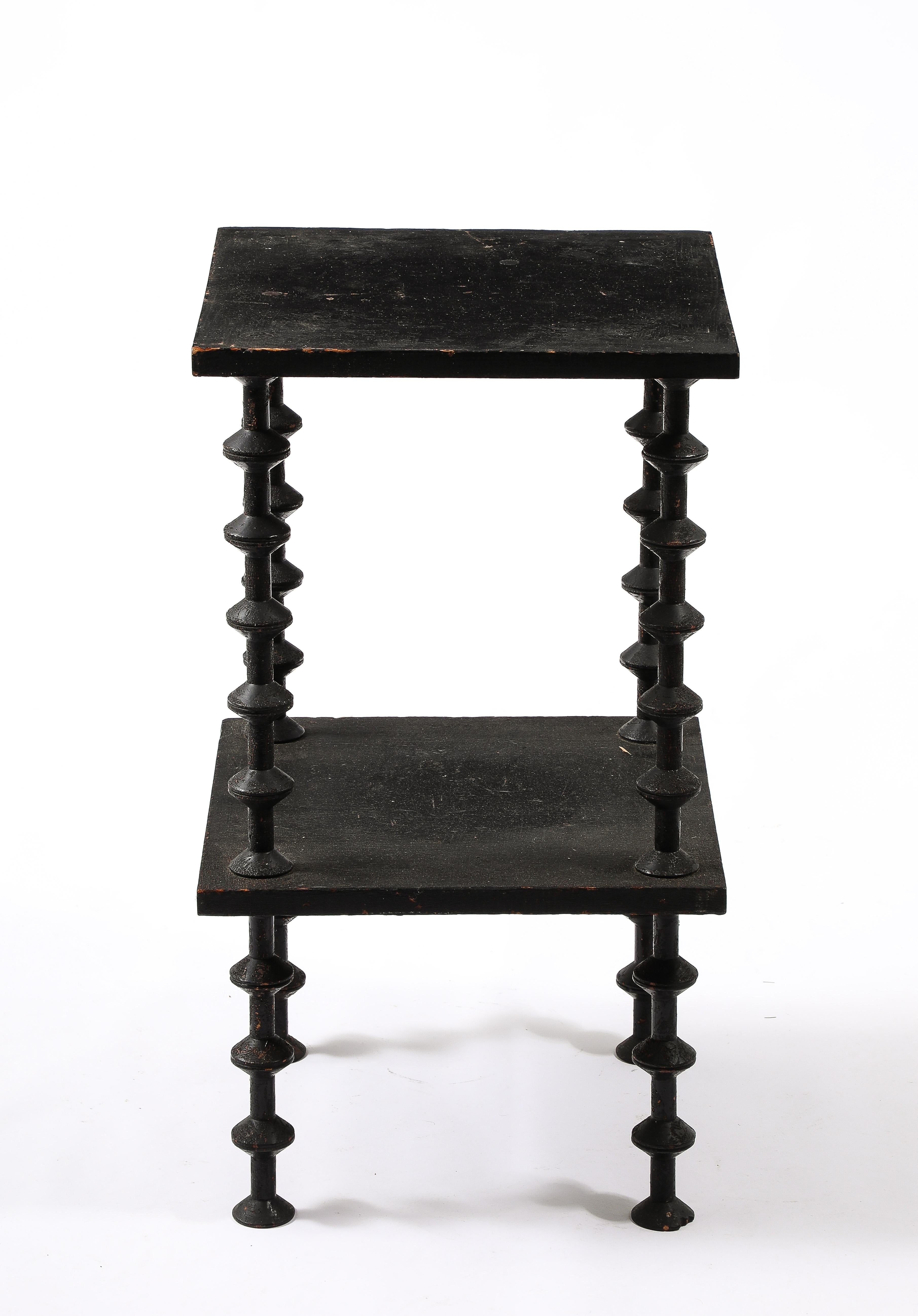 A folk art table made by reusing the core of wire spindles for the legs, a good example of an early form of reuse of an industrial byproduct