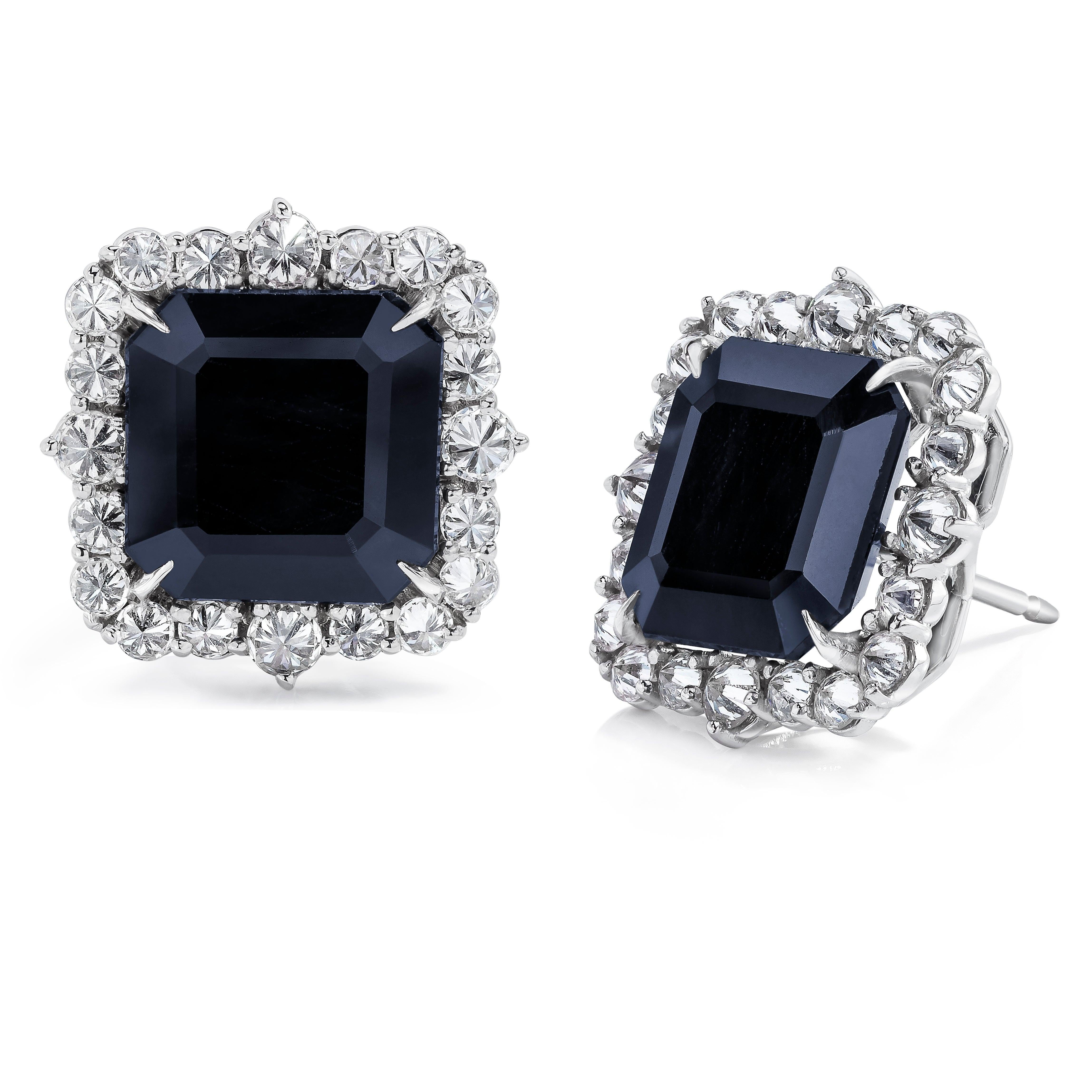 Beautiful and Bold Black Spinels weighing 16.22 Carats surrounded by Reverse Set White Round Brilliant Diamonds weighing 2.33 Carats. Set in 18 Karat White Gold.