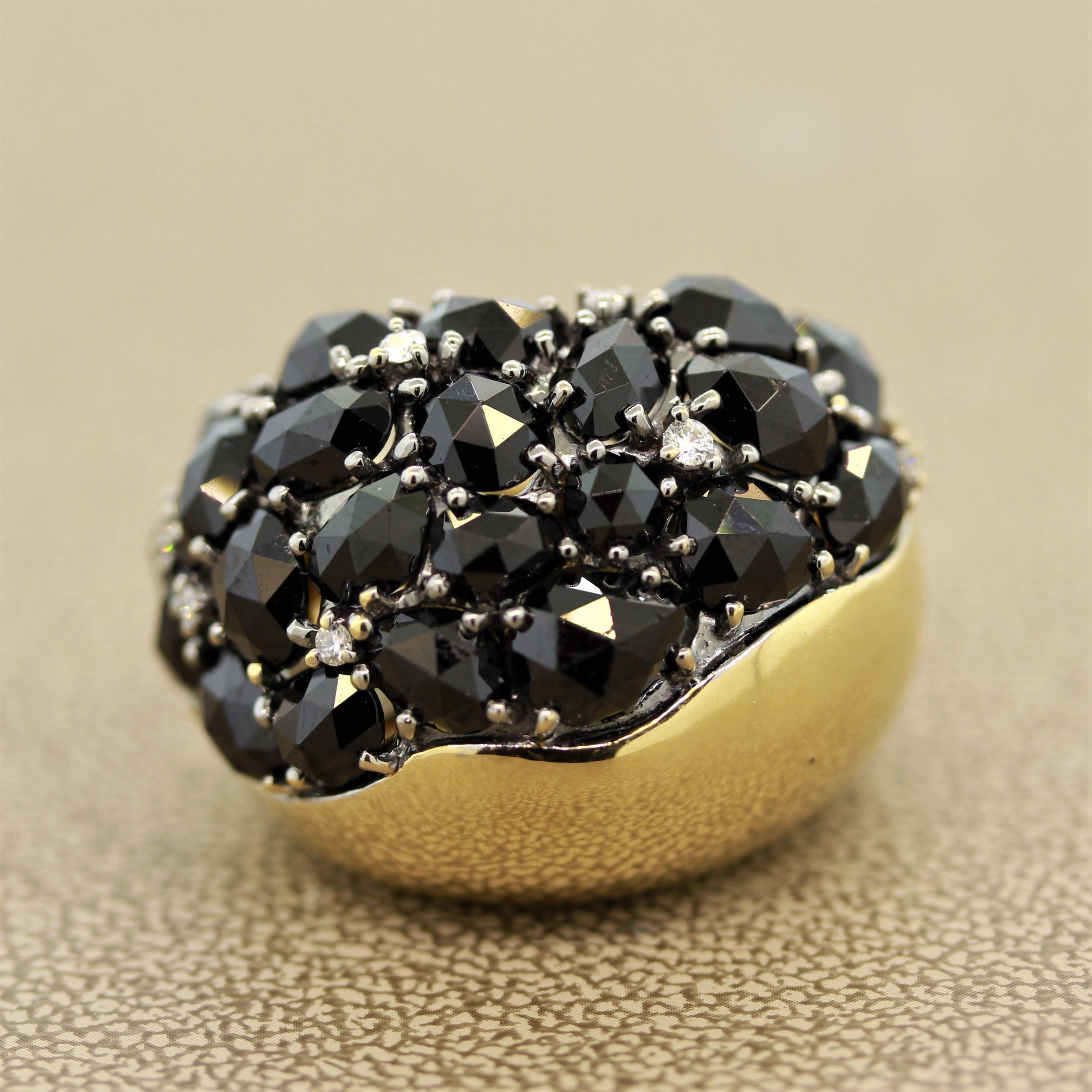 A fine designer ring featuring 11.40 carats of rose cut black spinel are round brilliant cut diamonds. The black spinel and bright white diamonds complement each other with their contrasting colors. Set in 18k yellow gold this cocktail ring will