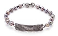 Bracciale artigianale in argento con perle di spinello nero