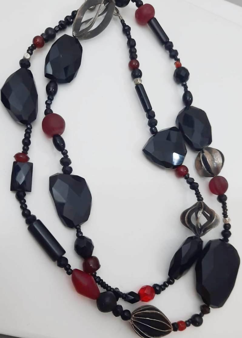 From our Jerusalem workshop this necklace is a one of a kind.
 Composed of 3 mm round faceted  black spinel beads and various onyx beads as well as various Red Glass and Red Crystal Beads ,
in addition there is a selection of hand crafted unique