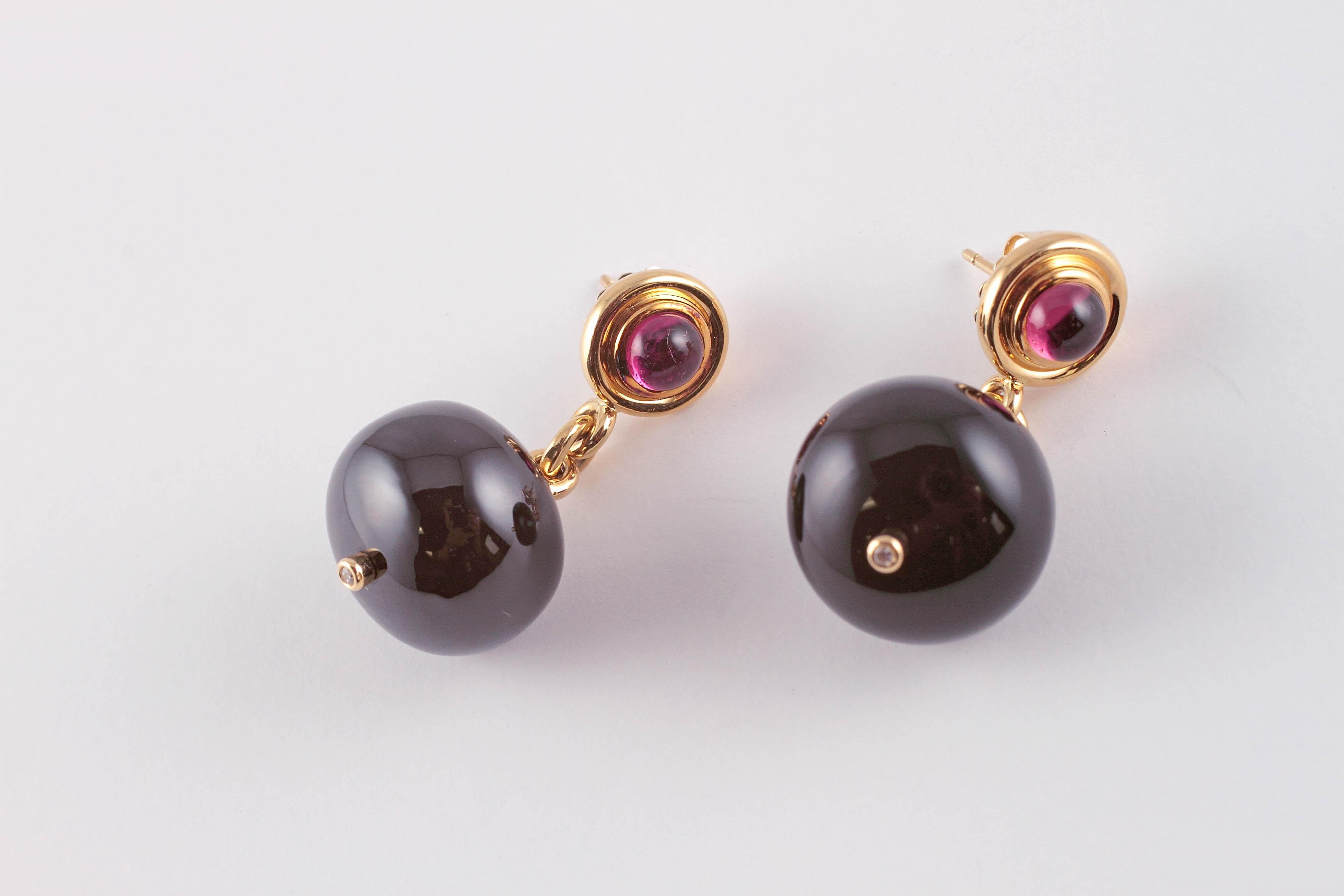 Want something a little out of the ordinary?  Then these are for you!  They are in 18 karat yellow gold, with approximately 2.50 cts of rubellite, approximately 90.00 cts of black spinel and accent diamonds on the bottom.....beautiful and bright and