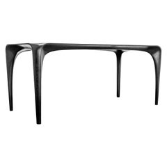 Mesa de comedor de fresno teñido de negro Spline Tallada a mano y firmada por Maxime Goléo