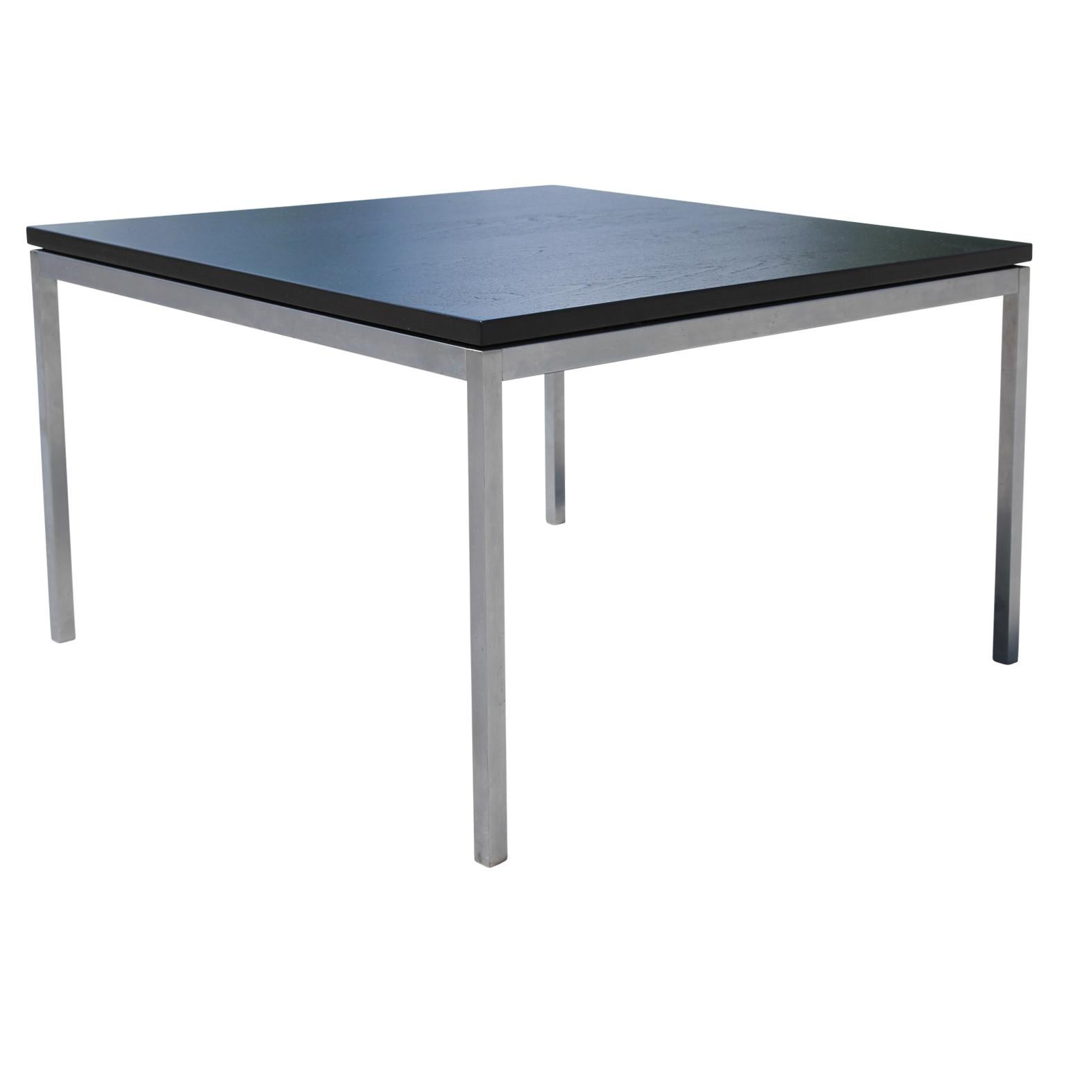 Beautifully black-stained oak table in the Mid-Century Modern style. There is a 