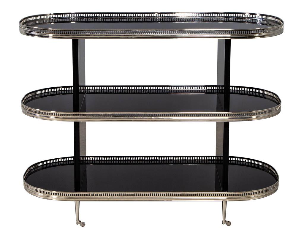 Black stainless steel bar cart trolley. Stunning black lacquer 3-tier bar cart, beautifully finished in a hand polished black lacquer with polished stainless steel lattice trim and casters.

Price includes complimentary curb side delivery to the
