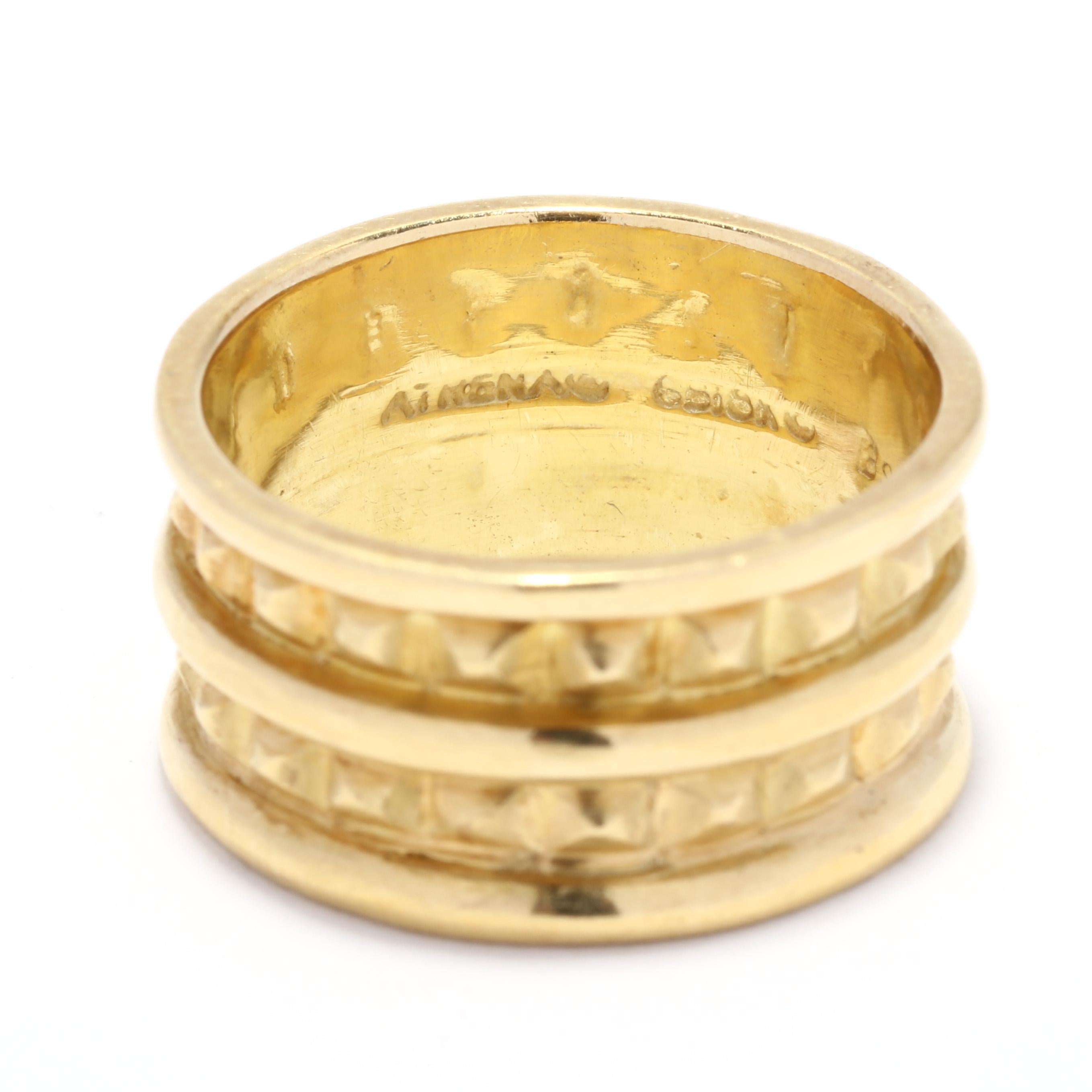 A vintage 18 karat yellow gold wide band designed by Black Star & Frost. This band features a double row of pyramids in an eternity design with polished rows in between and a slight textured detailing.

Ring Size 8.75

Width: 3/8 in.

Weight: 6.4