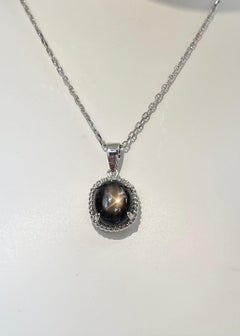Black Star Sapphire 5.45 carats Pendant set in 18K White Gold Settings