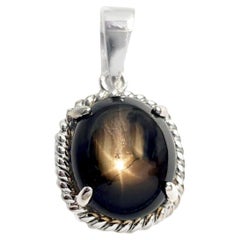 Black Star Sapphire 5.45 carats Pendant set in 18K White Gold Settings