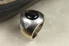 Black Star Sapphire and Diamond Three-Stone Dome Ring