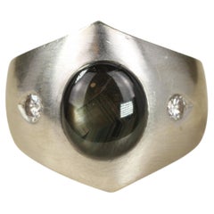 Black Star Sapphire and Diamond Three-Stone Dome Ring