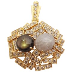 Black Star Sapphire, Blue Star Sapphire Pendant Set in 18 Karat Gold Settings