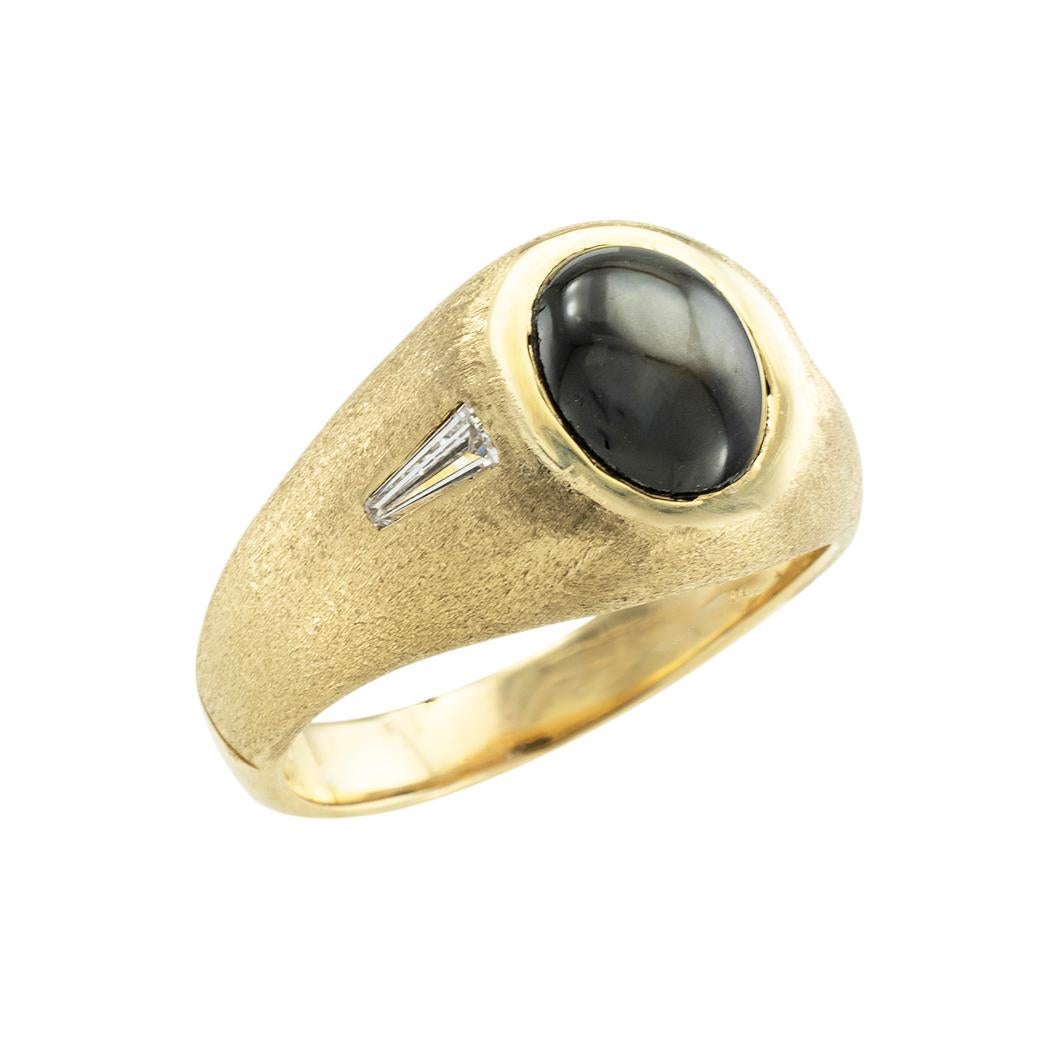 Black star sapphire and diamond gentleman’s gold ring, 1960s. *

ABOUT THIS ITEM:  #R-DJ1013B. Scroll down for detailed specifications.  The black star sapphire and diamond ring exudes elegance and masculinity.  The top portion of the ring features
