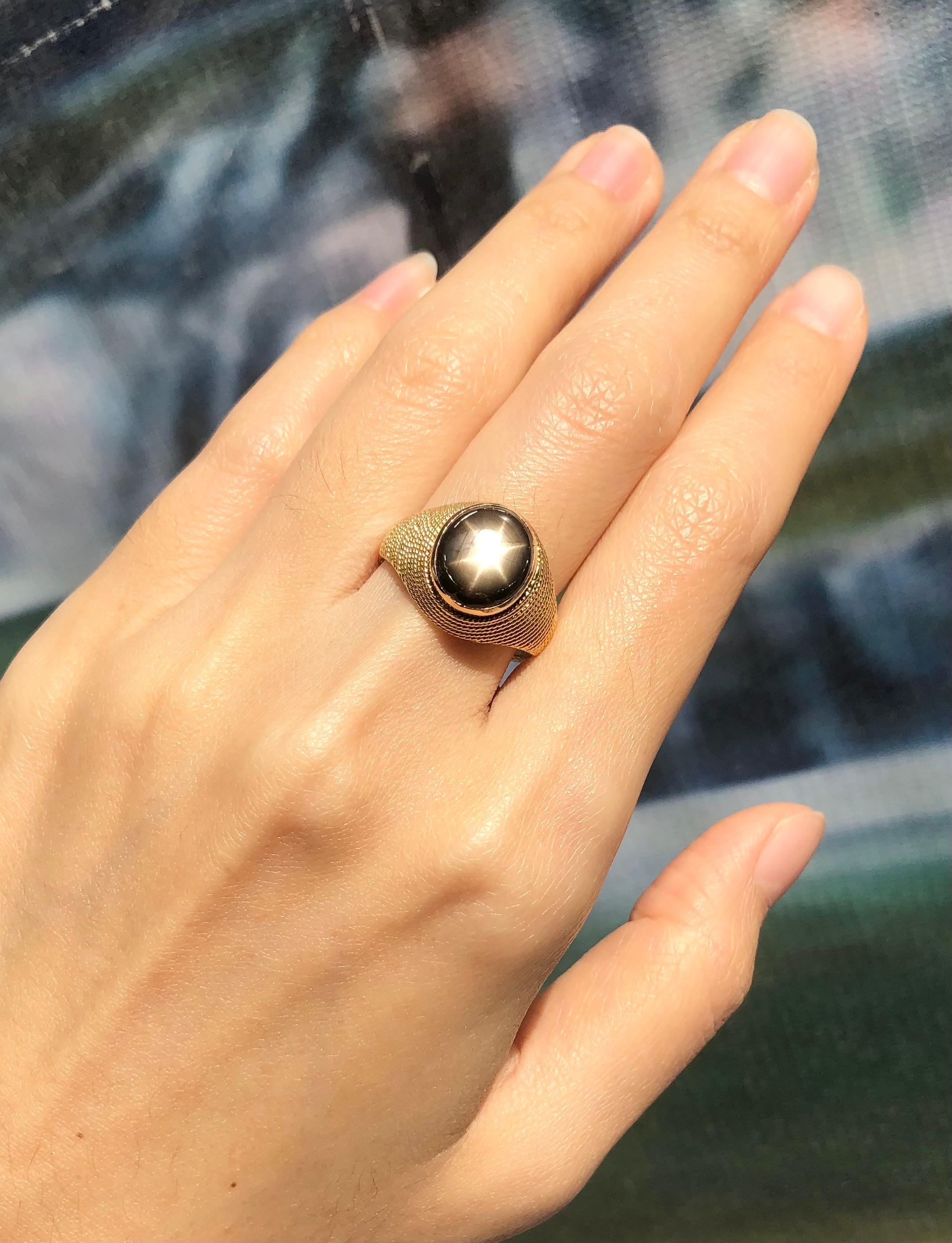 Contemporary Black Star Sapphire Ring Set in 18 Karat Gold Settings For Sale