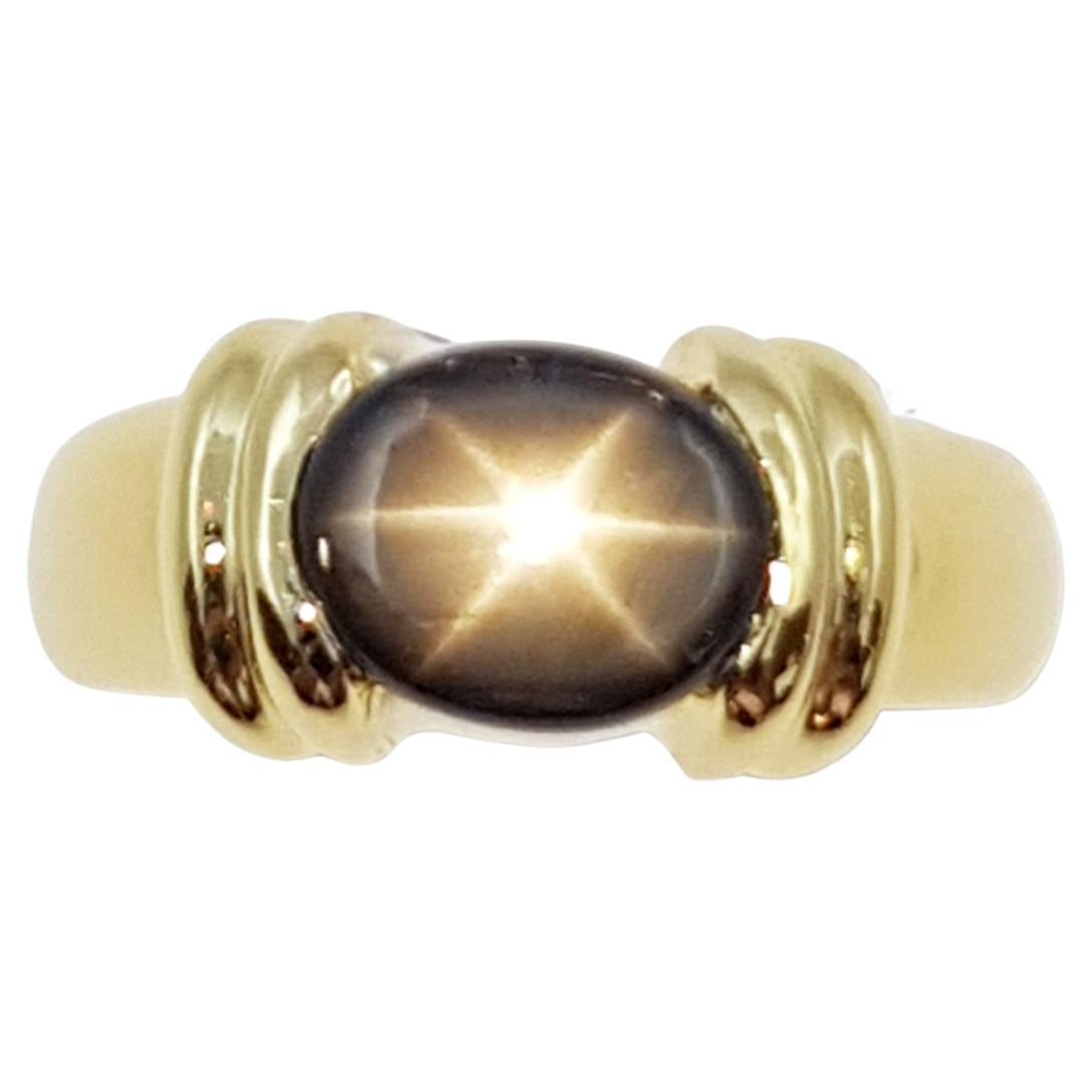Black Star Sapphire Ring Set in 18 Karat Gold Settings For Sale