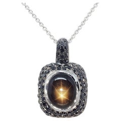 Black Star Sapphire with Black Diamond Pendant in 18 Karat White Gold Settings