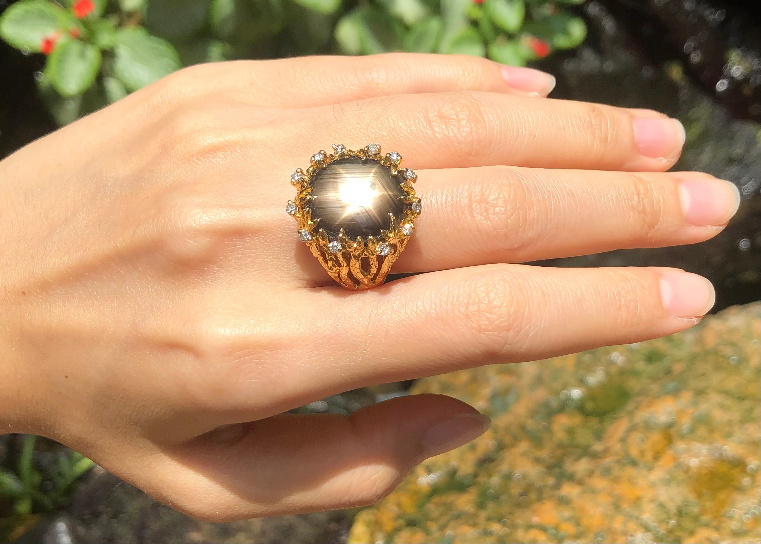 Black Star Sapphire 20.77 carats with Brown Diamond 0.32 carat Ring set in 18 Karat Gold Settings

Width:  2.0 cm 
Length: 2.2  cm
Ring Size: 55
Total Weight: 19.96 grams




