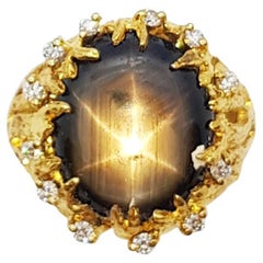 Black Star Sapphire with Brown Diamond Ring Set in 18 Karat Gold Settings