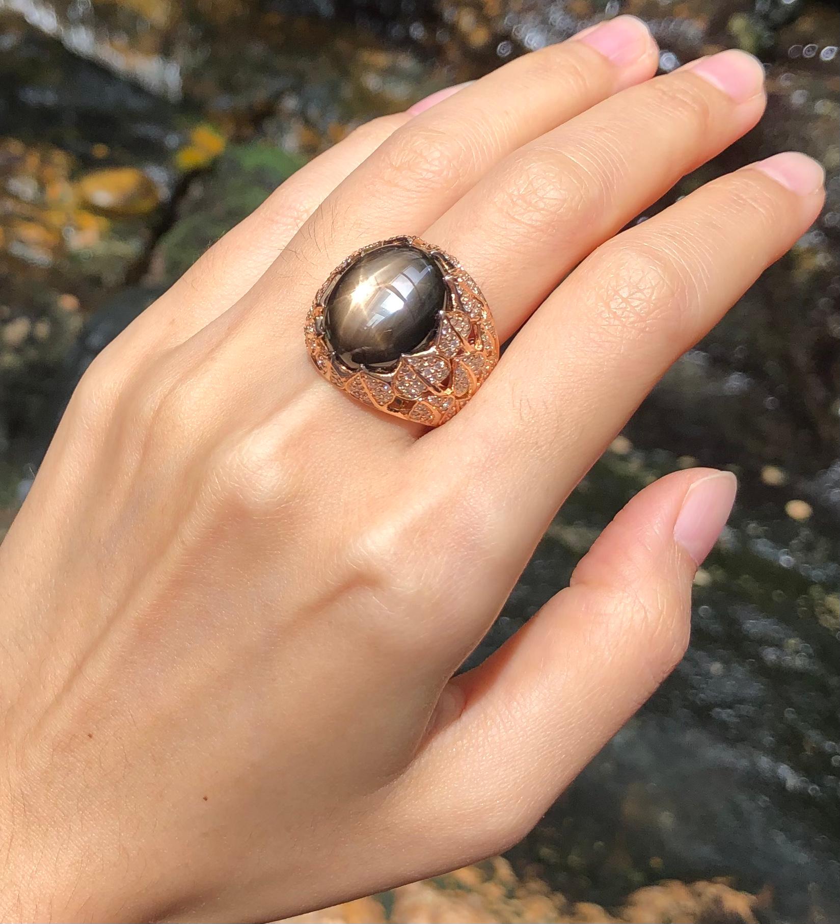 Contemporary Black Star Sapphire with Brown Diamond Ring Set in 18 Karat Rose Gold Settings For Sale