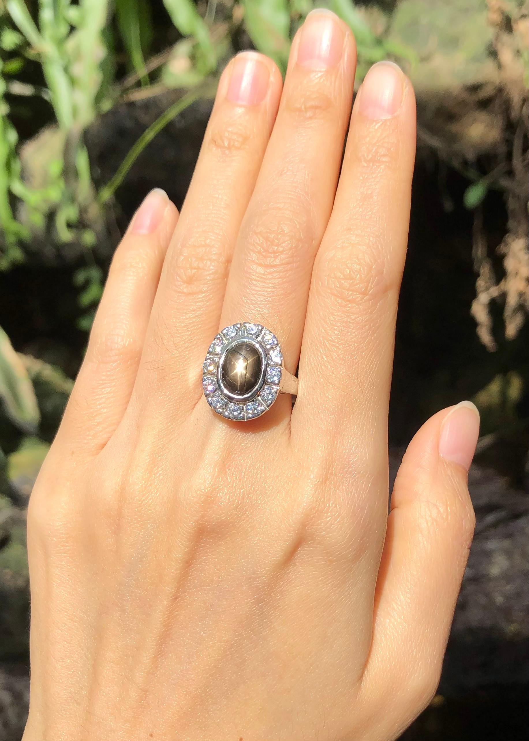 Contemporary Black Star Sapphire with Cubic Zirconia Ring set in Silver Settings For Sale