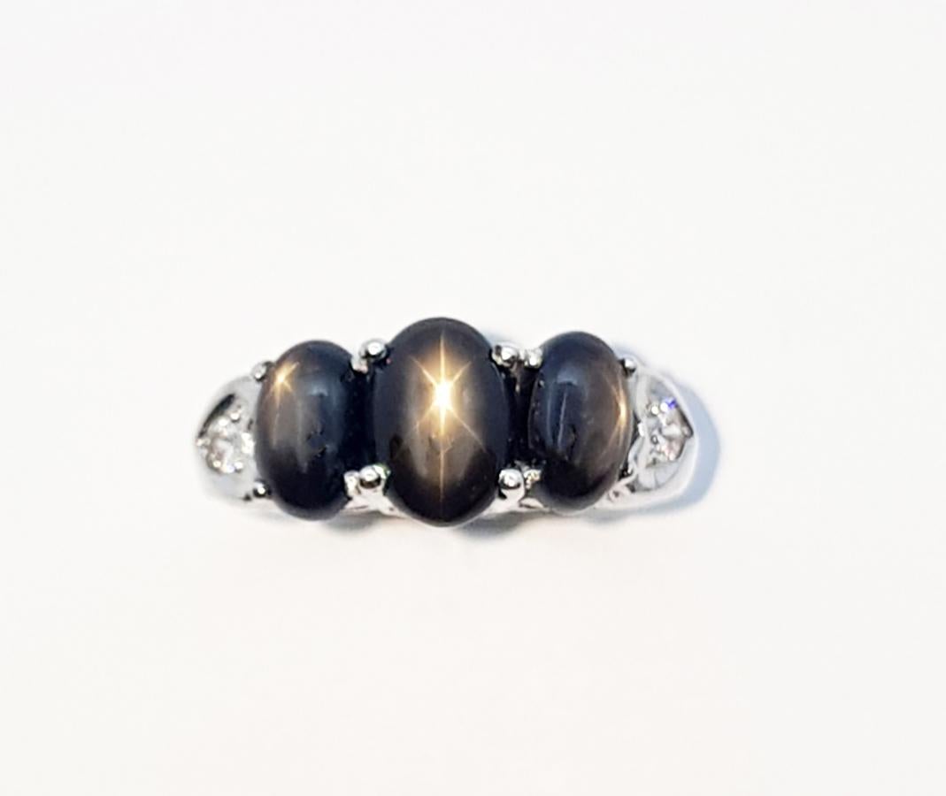 Cabochon Black Star Sapphire with Cubic Zirconia Ring set in Silver Settings