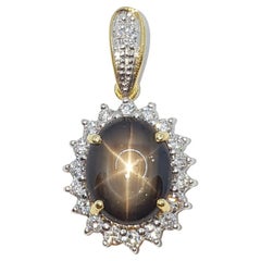 Black Star Sapphire with Diamond Pendant Set in 18 Karat Gold Settings