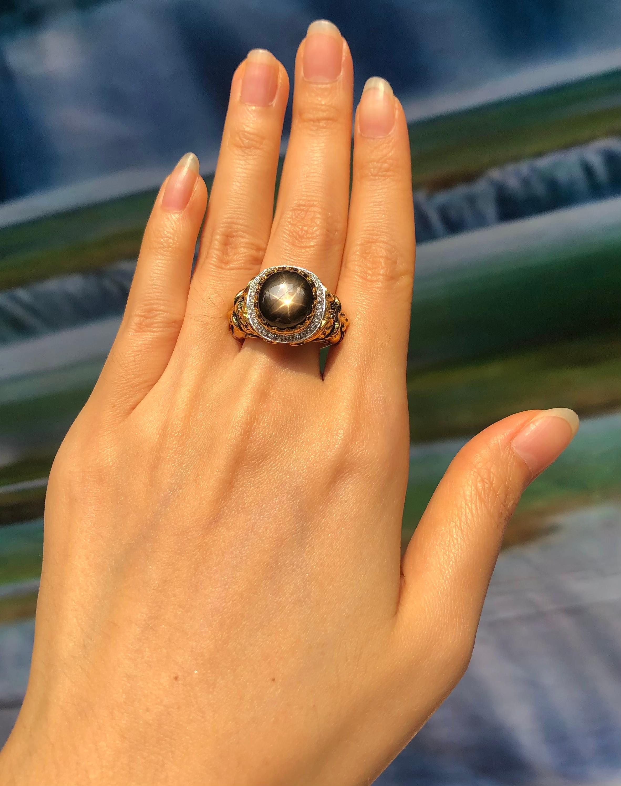 Black Star Sapphire 9.91 carats with Diamond 0.24 carat Ring set in 18 Karat Gold Settings

Width:  2.1 cm 
Length: 2.2 cm
Ring Size: 56
Total Weight: 20.39 grams

