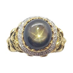 Black Star Sapphire with Diamond Ring Set in 18 Karat Gold Settings