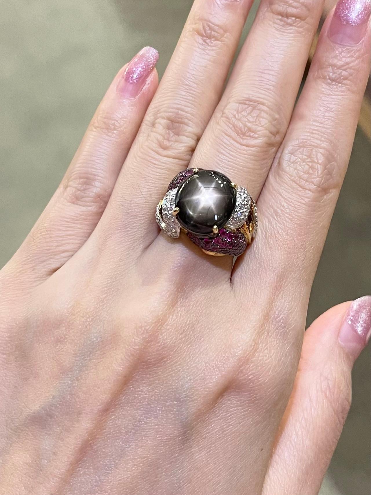 Black Star Sapphire 11.51 carats with Pink Sapphire 1.51 carats and Diamond 0.78 carat Ring set in 18K Gold Settings

Width:  1.2 cm 
Length: 1.3 cm
Ring Size: 53
Total Weight: 14.06 grams

