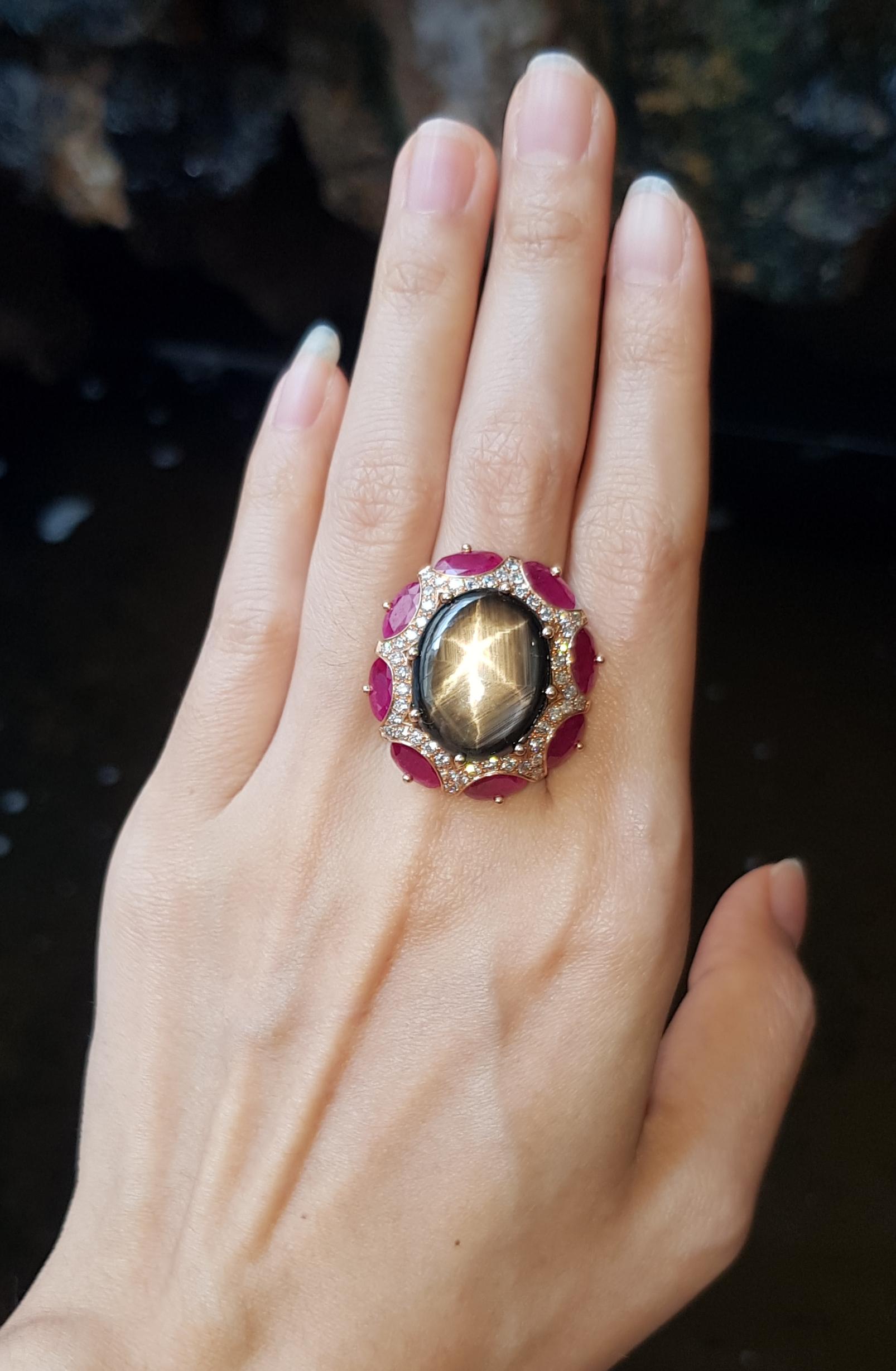 Contemporary Black Star Sapphire with Ruby and Brown Diamond Ring Set in 18 Karat Rose Gold For Sale