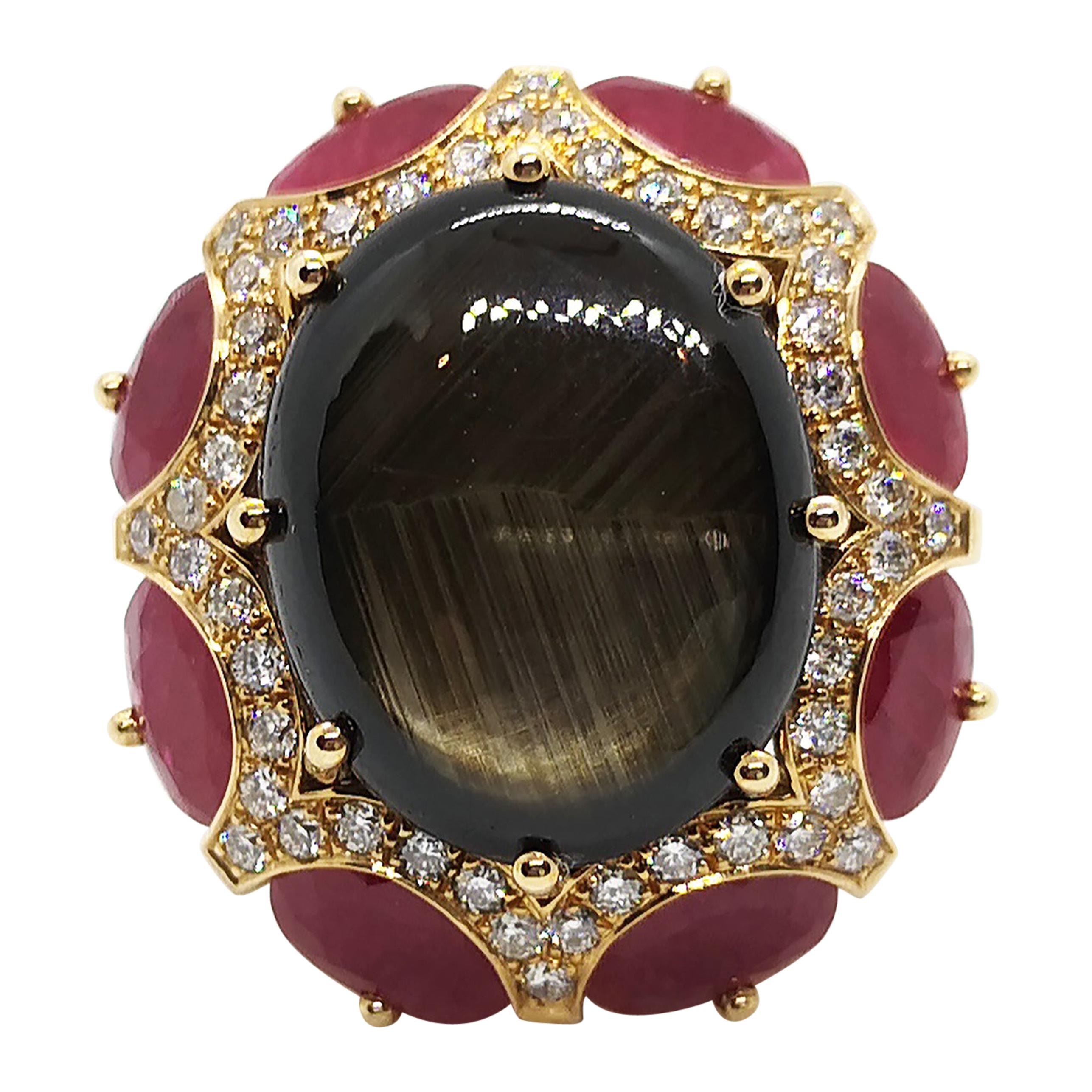 Bague en or rose 18 carats sertie d'un saphir étoilé noir, de rubis et de diamants bruns