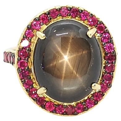 Black Star Sapphire with Ruby Ring Set in 18k Gold Settings For Sale