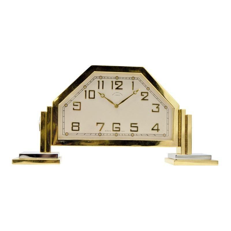 Factory / house: Black Star and Frost 
Style / Reference: Footed Desk Clock
Metal / Material: Gilt and Nickle Finished
Circa / Year: 1930's
Dimensions / Size: 8
