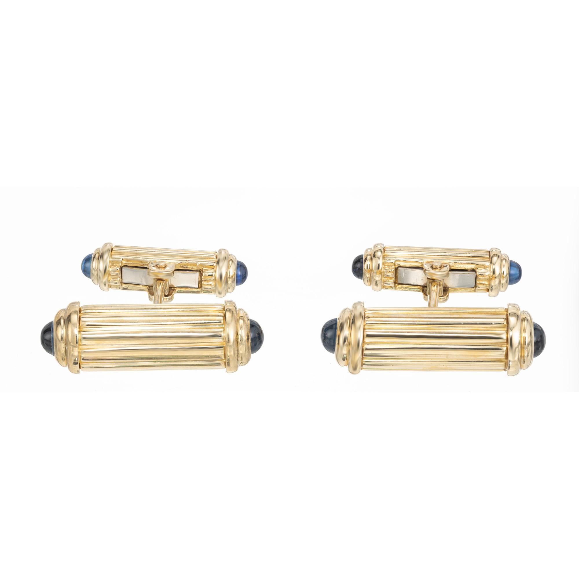 Black Starr and Frost men's cufflinks. 18k yellow gold double sided cylinder cufflinks, each end of the cylinders is adorned with a cabochon sapphire. Classic and stylish. 
 Black, Starr & Frost was founded in 1810, is America's First Jeweler.