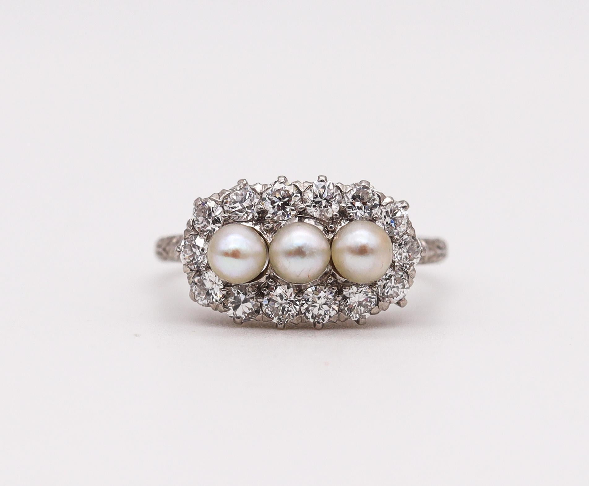 A ring designed by Black Starr & Frost.

Beautiful highly collectible piece, created in America back in the 1910. This delicate ring was crafted with late Edwardian and early art deco patterns in solid .900/.999 platinum. Embellished with natural