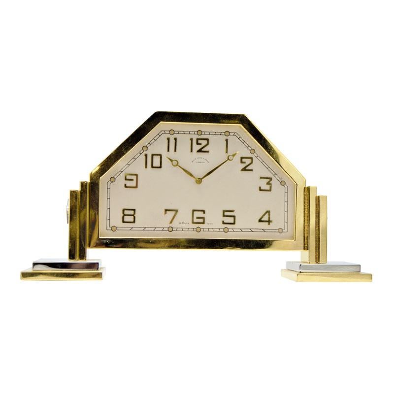 FACTORY / HOUSE: Black Star and Frost 
STYLE / REFERENCE: Footed Desk Clock
METAL / MATERIAL: Gilt and Nickel Finished
CIRCA / YEAR: 1930's
DIMENSIONS / SIZE: 8