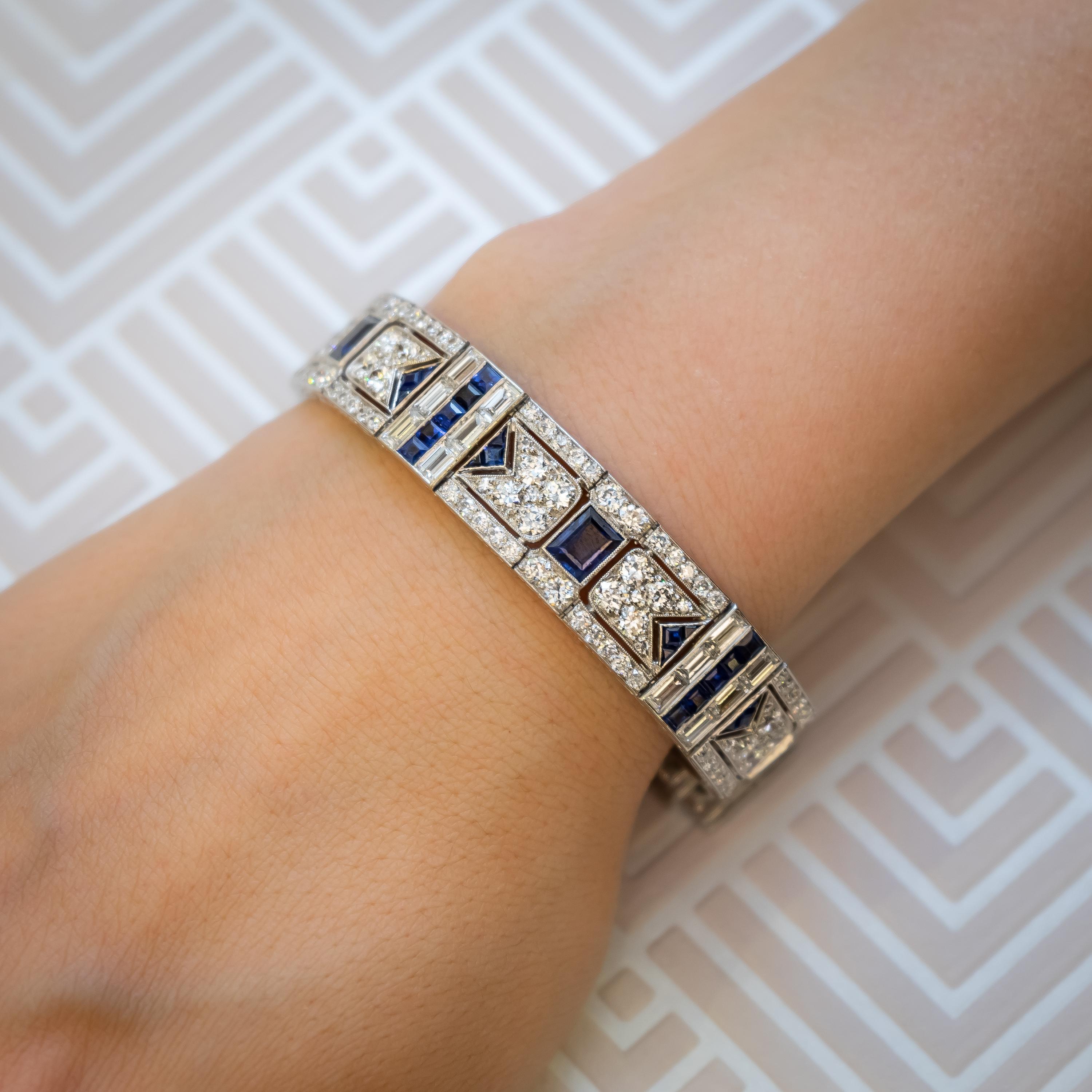 An Art Deco, sapphire and diamond bracelet, by Black Starr & Frost, of geometric design, set with Edwardian-cut and baguette-cut diamonds and calibré and faceted, rectangle cut sapphires. Composed of ten square and ten rectangular links, set with