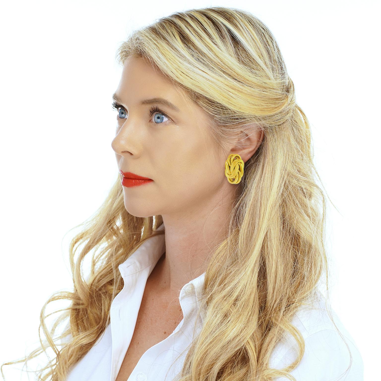 Circa 1960s, 18k, by Black Starr & Frost, New York. These gloriously chic yellow gold earrings by Black Star & Frost feature a Russian braid motif flawlessly complimented by a polished finish. Meticulously fabricated in eighteen-karat gold, they