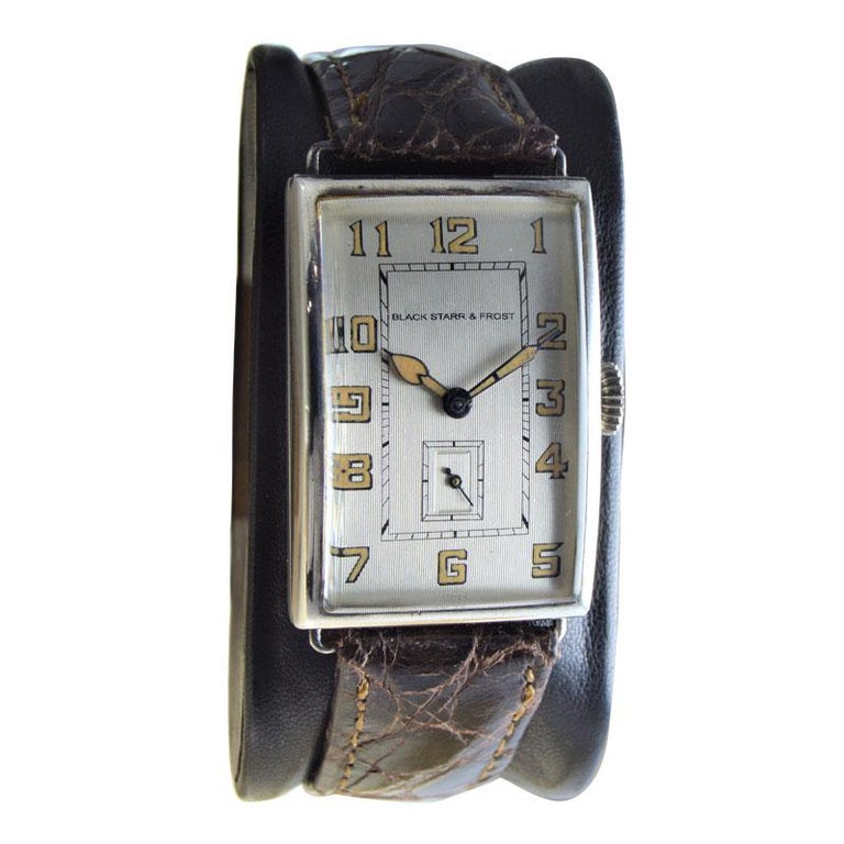FACTORY / HOUSE: Black Starr & Frost Jewelers
STYLE / REFERENCE: Art Deco Tank Style
METAL / MATERIAL: Silver
CIRCA / YEAR: 1920's
DIMENSIONS / SIZE: Length 39mm X Width 24mm
MOVEMENT / CALIBER: Manual Winding / 17 Jewels / CAL 10 1/2 L
DIAL /